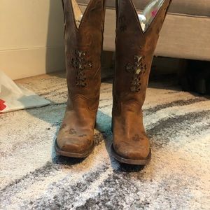 Dusty Rocker leather cowgirl boots.